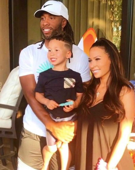 Larry Fitzgerald with his girlfriend and son